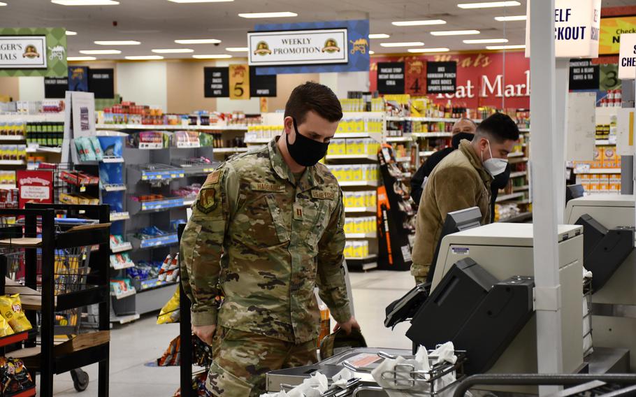 Airmen shop at the commissary at RAF Lakenheath, England, Nov. 30, 2021. The country’s mask mandate is slated to end Jan. 27, but Air Force officials still are reviewing whether changes to the on-base mandate will be made.