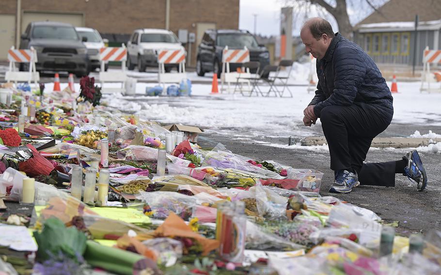Gov. Jared Polis visits Club Q and pays respects at the memorial for the victims of the Club Q shooting in Colorado Springs, Colo., on Nov. 29, 2022. 