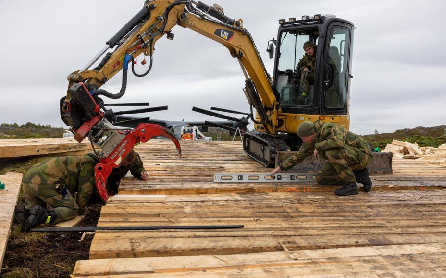 Norwegian army engineers assemble a makeshift wooden ramp during recovery operations for a U.S. Air Force CV-22 Osprey on Seja island, Norway, in September. 