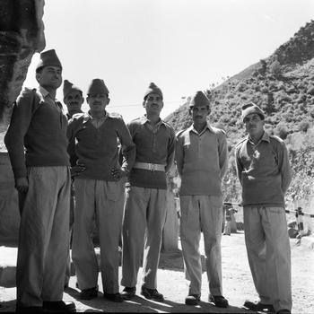 A group of Pakistani security personnel standing and posing for a photo. 