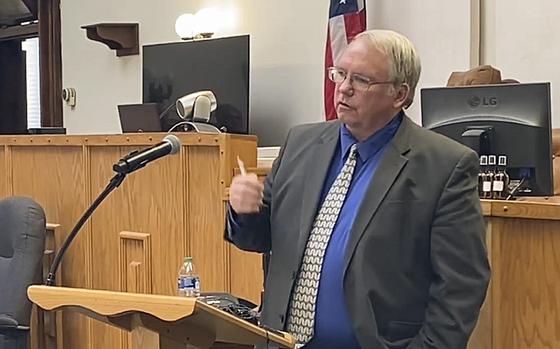 A video screen grab shows Mike Clague, a prosecutor and Navy veteran, talking about the second anniversary of a veterans treatment court in Montana.