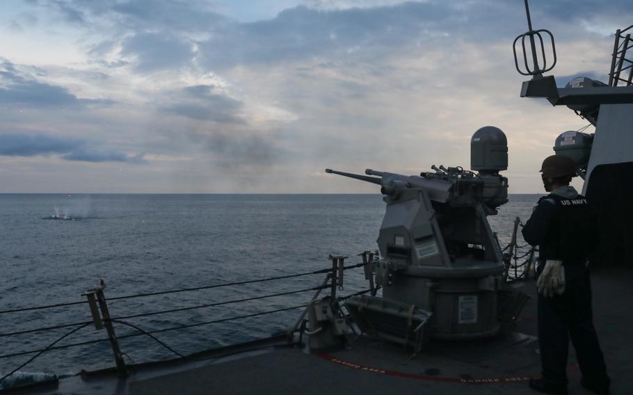 Sailors aboard the USS Ross fire a 25mm machine gun during a multinational exercise hosted by U.S. 6th Fleet and the Ukrainian navy in the Black Sea, July 7, 2021.
