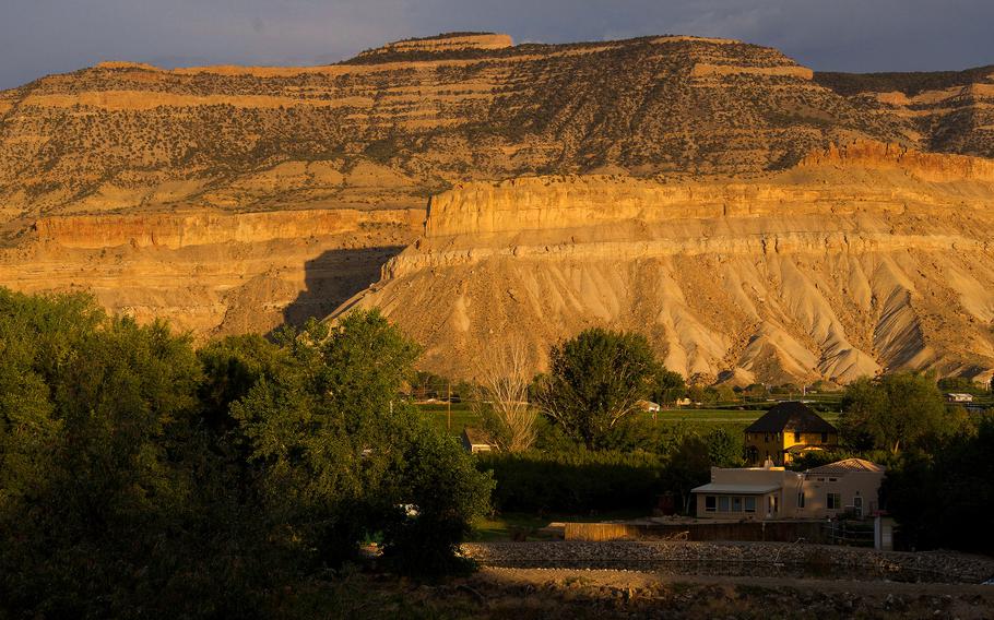 Grand Mesa rises above Palisade, Colo. The Palisade Plunge trail, which opened in July, drops 6,000 vertical feet from the top of the mesa to town. 