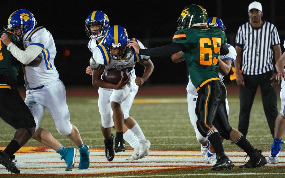 Yokota running back Josh Flores bulls through the line en route to 54 yards on eight carries against Edgren.