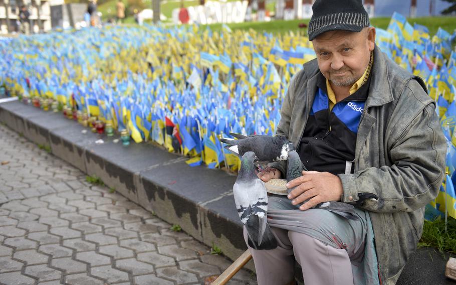 Valery, who declined to give his last name, comes to feed the pigeons every other week at the Maidan Nezalezhnosti, Kyiv’s central square. At his home, he doesn’t have electricity and there’s nothing for him to do, he said on Oct. 26, 2022. “At least here, they know me,” he added, referring to the pigeons.