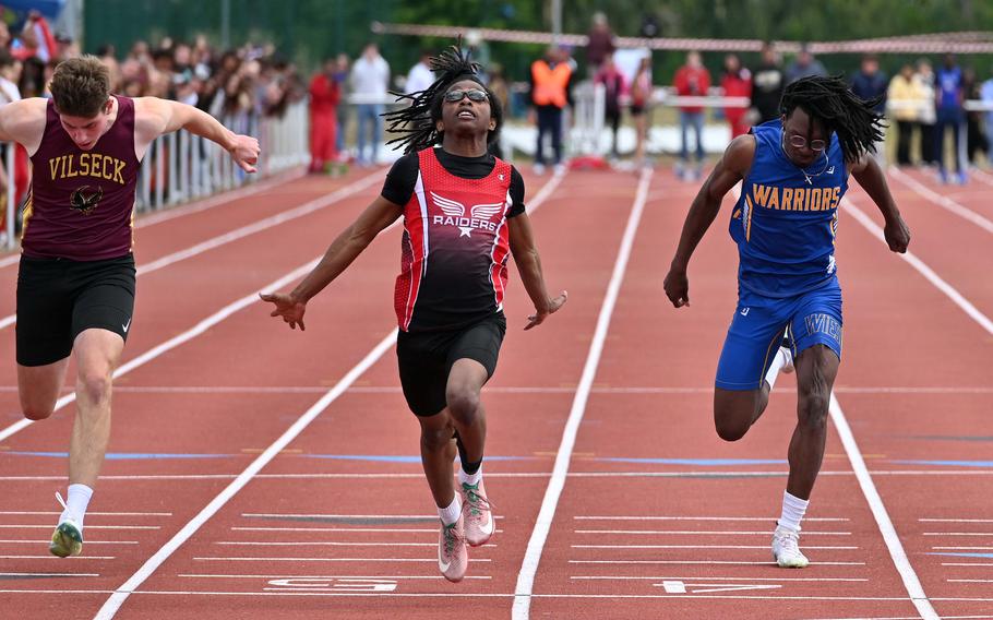 Kaiserslautern’s Quincy Seaberry, center, won the boys 100-meter race at the 2025 DODEA-Europe track and field finals, in Kaiserslautern, Germany, in 11.26 seconds, ahead of Vilseck’s Samuel Broyles and Wiesbaden’s Zion Thompson.