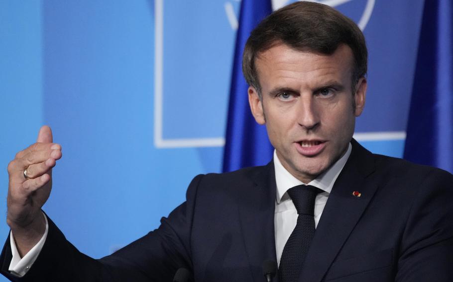 French President Emmanuel Macron speaks during a press conference after a NATO summit, June 30, 2022 in Madrid. French President Emmanuel Macron arrives in Yaounde, the capital of Cameroon, late Monday July 26, 2022, to begin his three-day tour to this central African nation as well as Benin and Guinea Bissau.