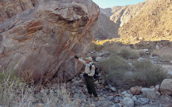 Agua Caliente Tribal Ranger Christopher Castro leads hikers through Tahquitz Canyon near Palm Springs. Though Castro isn’t one of the tribe’s roughly 500 members (none of the Tahquitz rangers are), he has been doing the job for a decade.