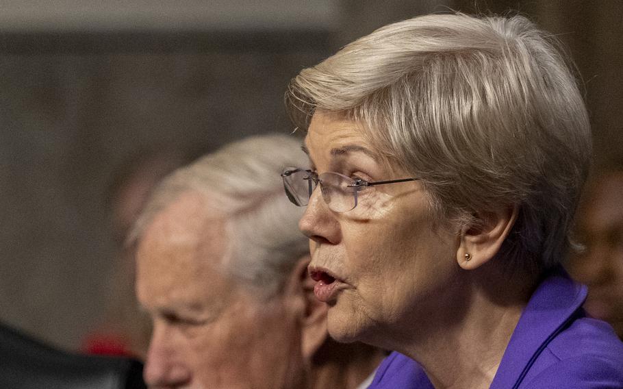 Warren speaks at a hearing.