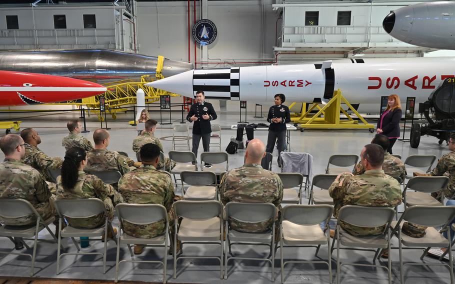 Thirty U.S. Space Force Guardians listen to updates about Space Force uniforms during the service’s Uniform Roadshow presentation Dec. 8, 2021, at Cape Canaveral Space Force Station, Fla. The presentation included briefings about the Space Force service dress uniform, as well as physical training attire. 