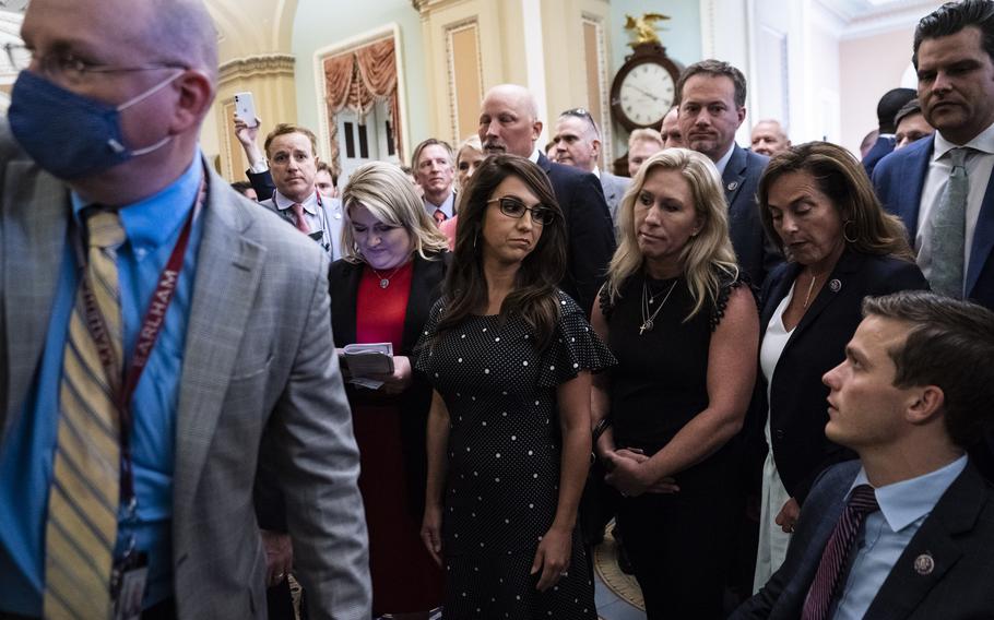 Republican members of Congress, including Reps. Lauren Boebert (Colo.) and Marjorie Taylor Greene (Ga.), center left and right, respectively, head to the Senate chamber in July in a protest of mask-wearing rules on the House side. 
