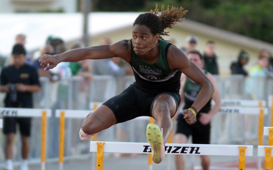 Carlos Cadet clears a hurdle.