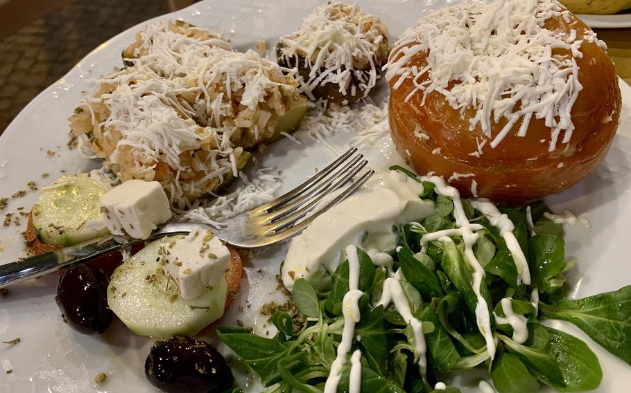 Magn' A Grecia's stuffed vegetables with rice includes zucchini, a mushroom cap and a tomato. 