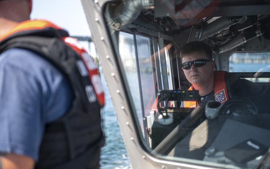 Petty Officer 3rd Class Benjamin Blakenship, a boatswain’s mate assigned to Coast Guard Station Destin, participates in tow training near Destin, Florida on June 23, 2022.