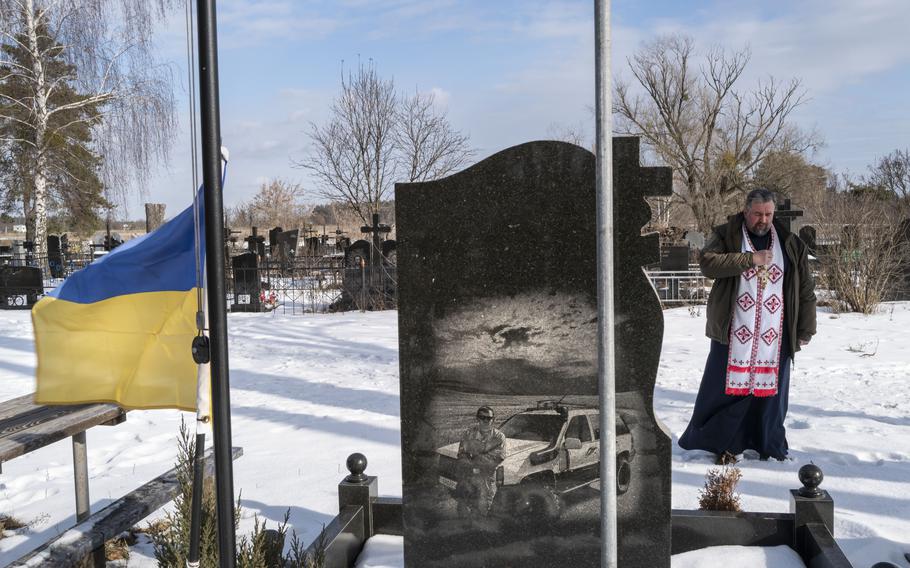 The Rev. Kostyantyn Kholodov, a Ukrainian military chaplain, leaves his small church after a Sunday morning service on Feb. 6 in Bucha, Ukraine.