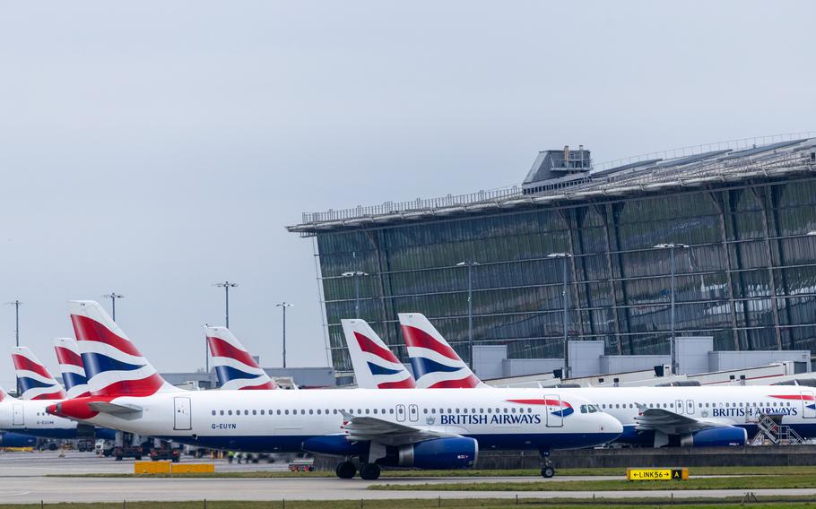 British Airways planes lined up at their Heathrow gates.