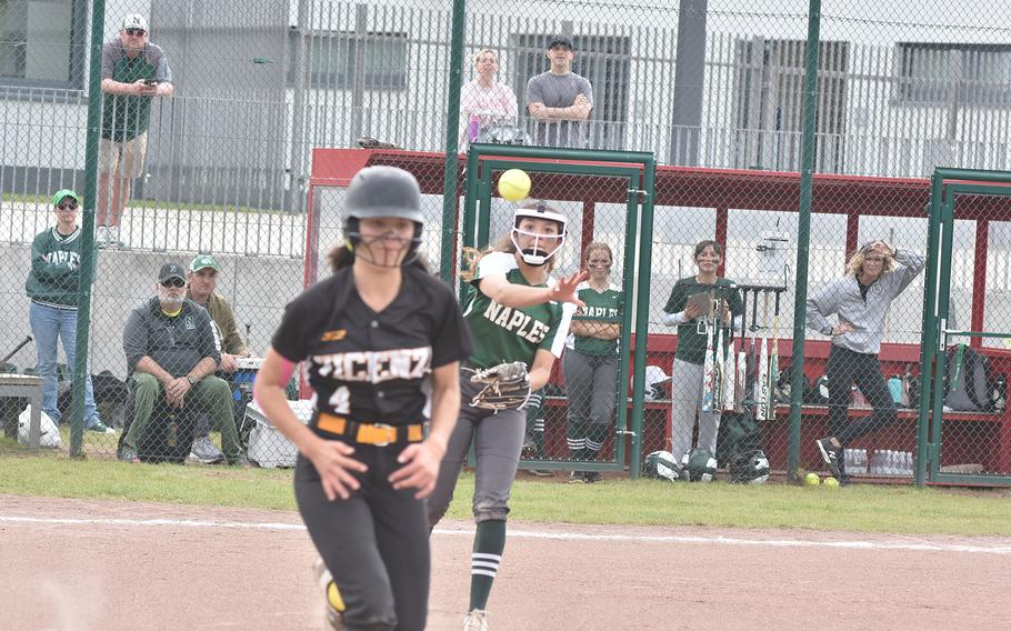 Naples  pitcher Kapriana Martinez throws the ball to first in time to get Vicenza's Katherine Green in the DODEA-Europe Division II/III softball championship game Saturday, May 20, 2023, at Kaiserslautern, Germany.