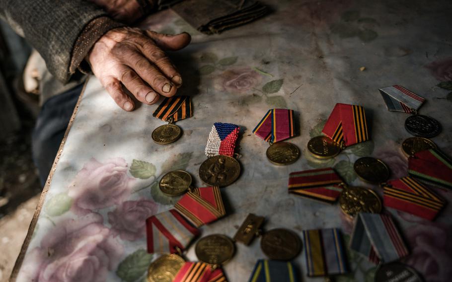 In Ukraine on Victory Day, World War II veteran Nikolai Manailo, 99, shows medals he earned fighting alongside Russians — and says he can hardly believe the countries are now at war.
