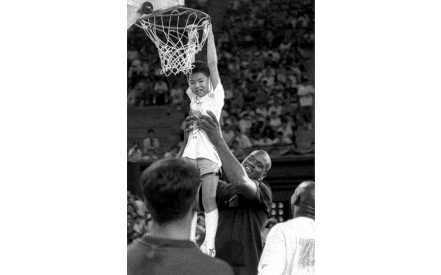 Shaquille O’Neal conducts a basketball clinic in Tokyo in August, 1993.