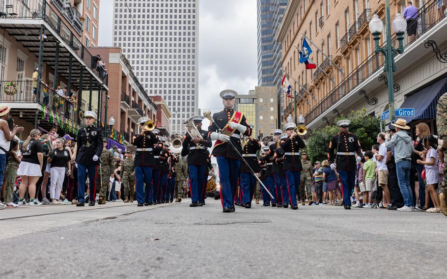 The Marine Forces Reserve Band marches through the city