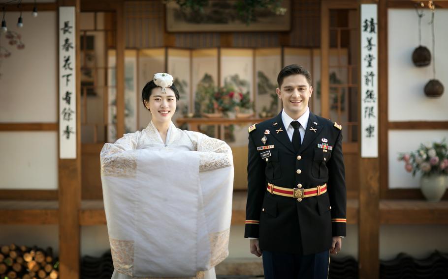 U.S. Army Capt. Miles Gabrielson and South Korean army Capt. Ha Neul, pose on their wedding day in Busan, South Korea, Feb. 20, 2021. In lieu of a honeymoon, the couple toured five South Korean cities with their families due to the coronavirus pandemic.  