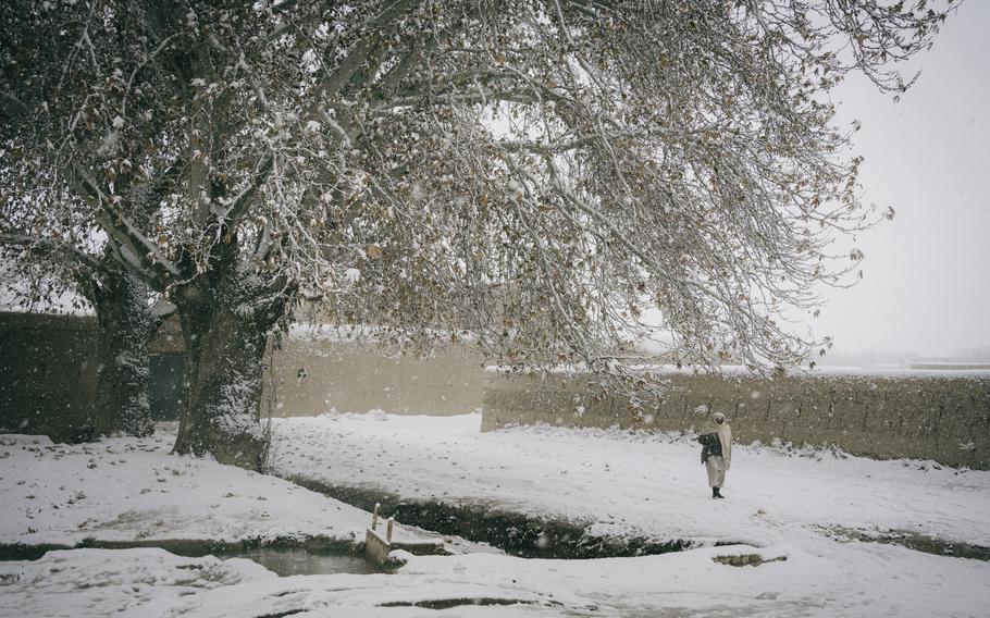 120p na               A man walks in the snow in Mazar-e Sharif. MUST CREDIT: Photo by Lorenzo Tugnoli for The Washington Post.