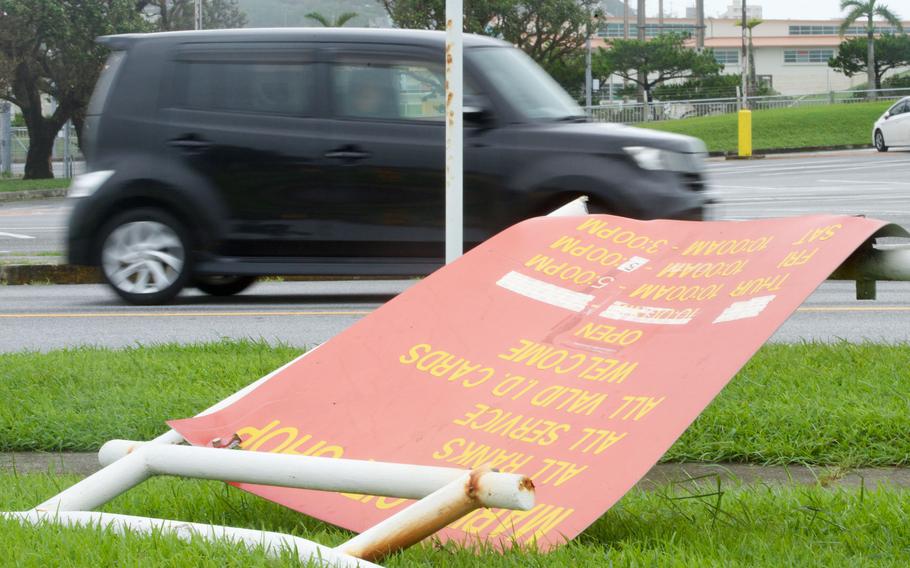 The base thrift shop sign lays toppled at Camp Foster, Okinawa, Thursday, Aug. 3, 2023, in the wake of Typhoon Khanun. 