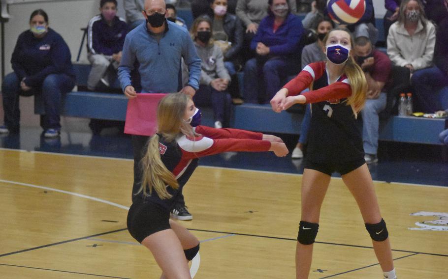 Aviano's Elaina Holsclaw, right, and Jaycee Spence get set to return the ball Friday, Oct. 15, 2021, against the Naples Wildcats. Holsclaw hit the ball back to the Wildcats, who prevailed 25-16, 25-19, 25-14.