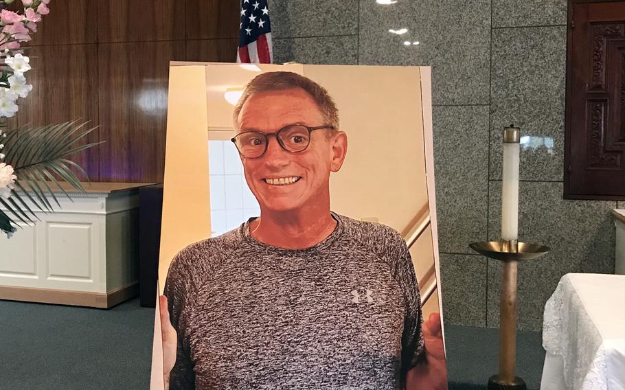 A photo of the Charles Mecke, food and beverage flight chief for the 374th Force Support Squadron at Yokota Air Base, Japan, is displayed during his on-base memorial service, March 1, 2024. 