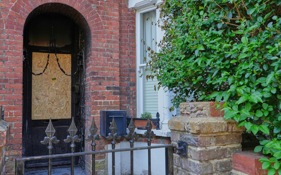 A gate and door of a house.
