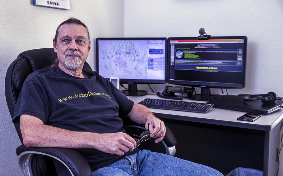 Webmaster Joerg Arnu sits at his home work station on Sept. 17, 2020, In Rachel, Nevada, where he creates websites including the one adverse to Alienstock