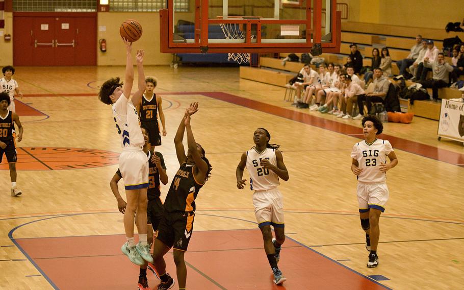 Sigonella's Andrew Martin rises for a shot in the paint during a DODEA-Europe Division III basketball semifinal game Feb. 17, 2023, in Baumholder, Germany.