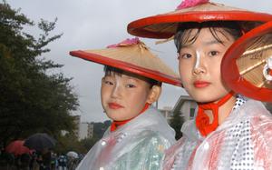Hed: Raining on the parade, 2005

Yokosuka, Japan, Oct. 16, 2005: The rainy weather didn’t curb the crowds at Yokosuka’s Mikoshi Parade, but costumes were altered to repel the wet weather.

Looking for some fun activities to do around your Pacific base? Check out Stars and Stripes' Quick Trips here.
https://www.stripes.com/living/pacific_travel/quick_trips/

META TAGS: travel; day trips; weekend getaway; last minute trips; tours 