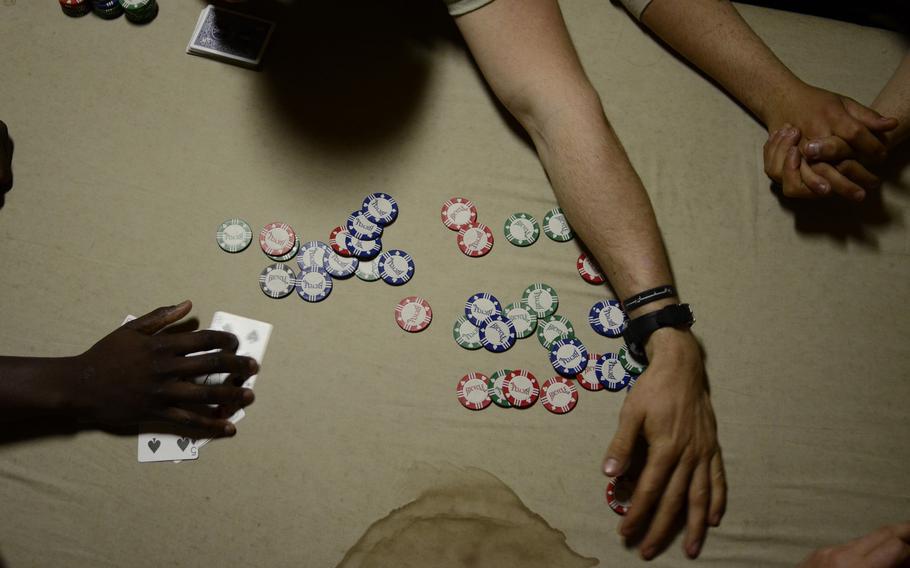 Soldiers with the 1st Battalion, 501st Infantry Regiment deployed to Combat Outpost Sabari occasionally play poker to fill their downtime.