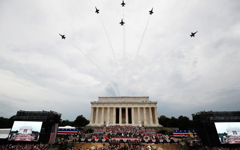 The Lincoln Memorial can be seen in the background as a flyover happens in the foreground.