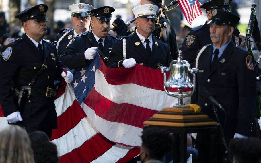 A memorial flag is brought onto the stage during ceremonies to commemorate the 20th anniversary of the Sept. 11 terrorist attacks, Saturday, Sept. 11, 2021, at the National September 11 Memorial & Museum in New York.