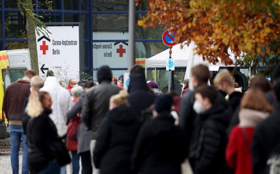 Visitors queue for Covid-19 vaccinations at the Messe Berlin exhibition center in Berlin on Nov. 15, 2021. MUST CREDIT: Bloomberg photo by Liesa Johannssen-Koppitz.