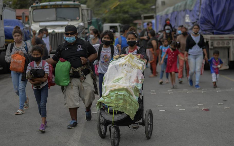 Migration of Hondurans, shown here on a voluntary return in El Florido, Guatemala, in January 2021, has become a campaign issue in the Honduran election Sunday, Nov. 28. The exodus due to crime, poverty and natural disasters has sapped Honduras of many of its best people, candidates say.