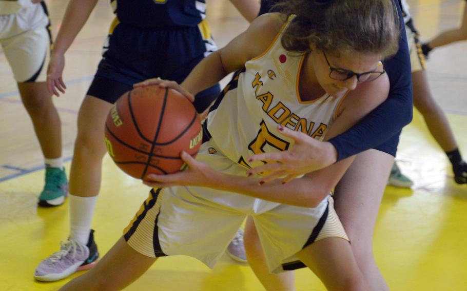 Kadena junior Marina Sawyer finds herself bottled up by Taipei American's defense during Saturday's 42-37 win by the Panthers.