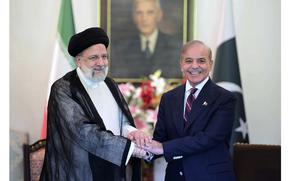 Iranian President Ebrahim Raisi, left, shakes hand with Pakistan's Prime Minister Shehbaz Sharif prior to their meeting at prime minister house in Islamabad, Pakistan, Monday, April 22, 2024. 