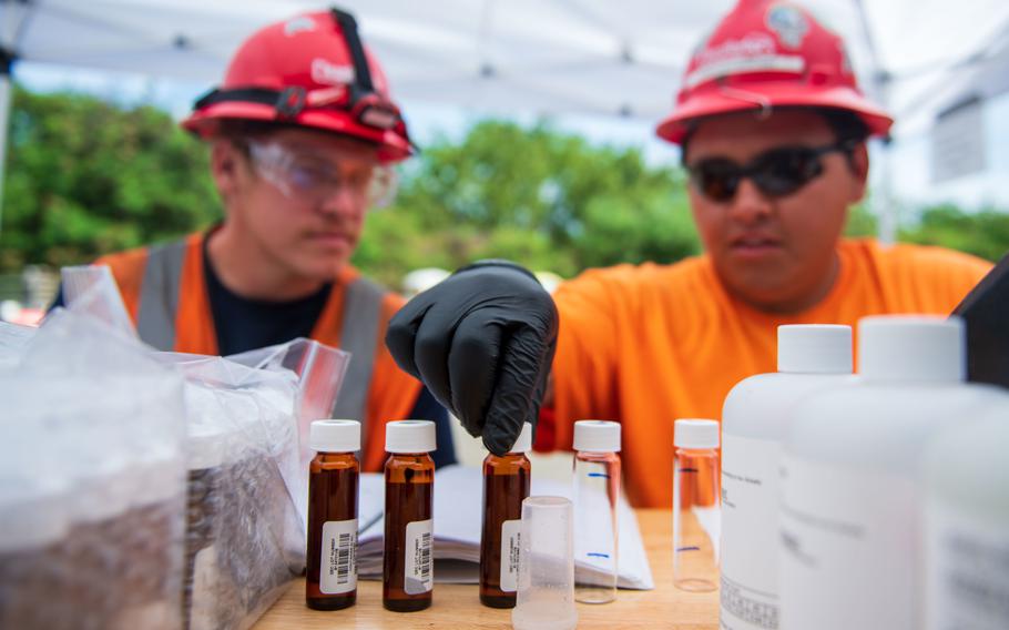 Navy contractors process water samples on March 17, 2022, as a part of monitoring at the Red Hill well in Aiea, Hawaii.