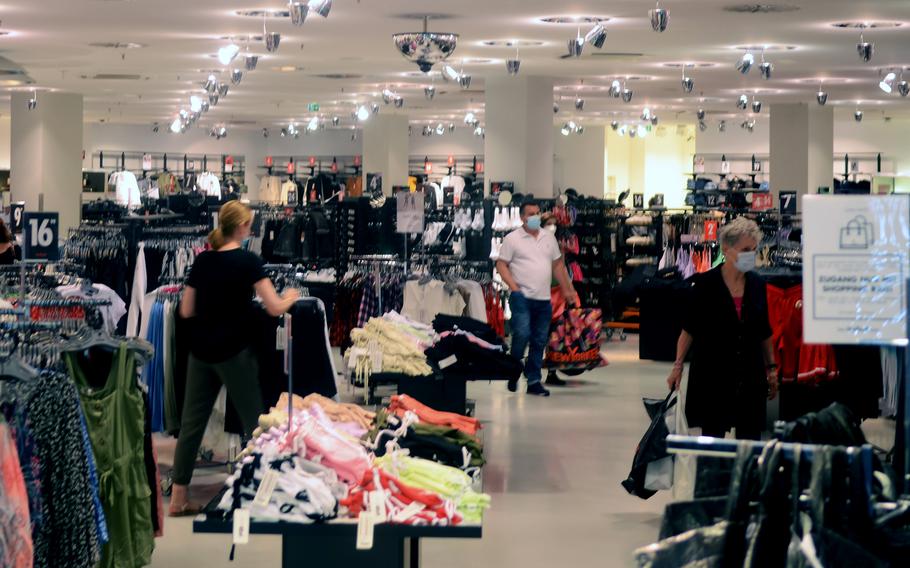 Customers enjoy shopping at the ''New Yorker'' in the LuisenForum mall in Wiesbaden, Germany on June 10, 2021. Coronavirus restrictions on shopping, indoor dining, sporting events and other facets of daily life continue to ease in the city, which is home to U.S. Army Europe and Africa headquarters. 