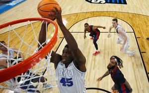 Fousseyni Traore (45) of the Brigham Young Cougars dunks the ball against the Duquesne Dukes during the second half in the first round of the NCAA Men's Basketball Tournament at CHI Health Center on March 21, 2024 in Omaha, Nebraska. (Jamie Squire/Getty Images/TNS)