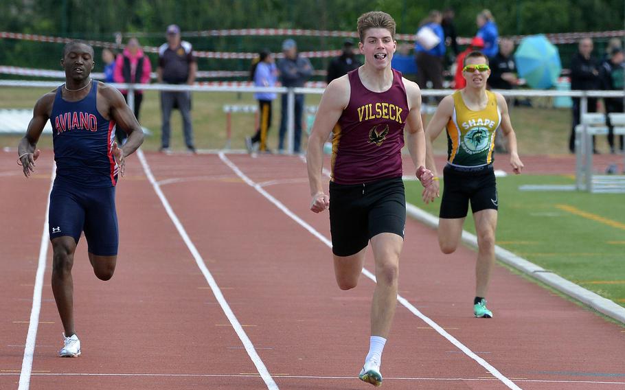 Vilseck’s Samuel Broyles powers his way to the finish line on his way to winning the 400-meter race at the 2025 DODEA-Europe track and field finals, in Kaiserslautern, Germany,  in 50.91 seconds. At left is Aviano’s Christian Perkins, at right SHAPE’s Tudor Varvari.