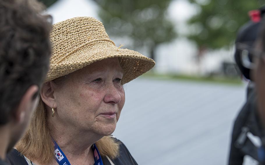Anne McEnerny-Ogle tears up with emotion moments after finding her uncle's name on the new Wall of Remembrance at the Korean War Memorial in Washington, D.C., on Tuesday, July 26, 2022.