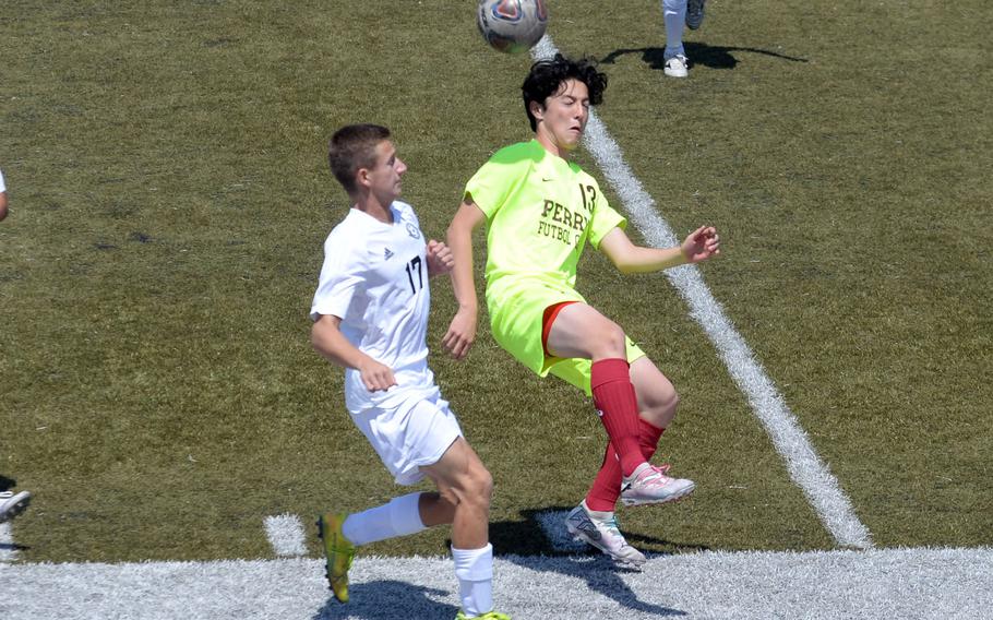 Kadena's Micah Berry and Matthew C. Perry's Preston Ramirez try to head the ball during Saturday's DODEA interdistrict boys soccer match. The Panthers won 2-0