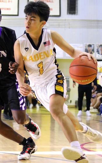 Kadena's Jaden Patsel dribbles against Zion Christian during Tuesday's 61-57 Panthers win over the Lions in the Far East Divison I knockout round.