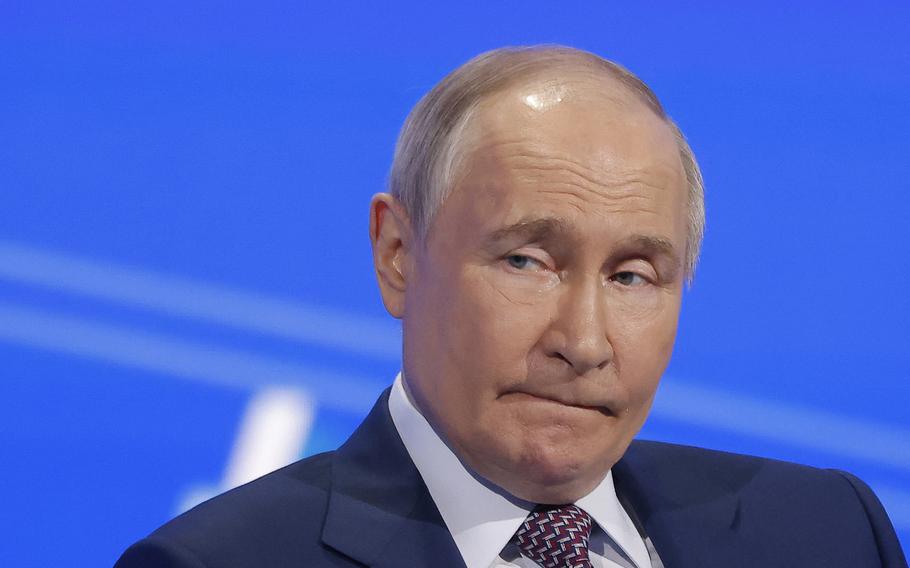 Vladimir Putin looking at something off camera.