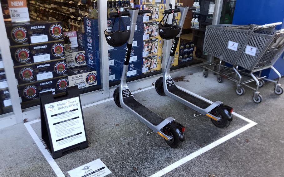 Electric scooters for rent are parked outside a shop on the east side of Yokota Air Base, Oct. 20, 2021. 