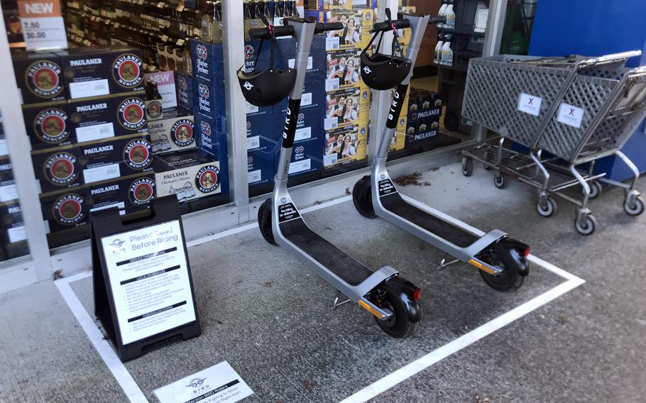 Electric scooters for rent are parked outside a shop on the east side of Yokota Air Base, Oct. 20, 2021. 